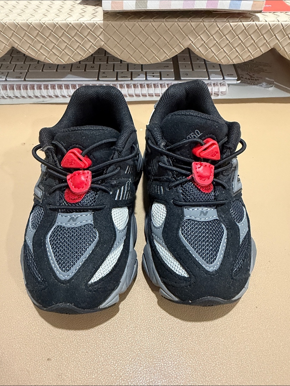 New balance Kids Black and Gray Athletic Sneakers with Red Accents